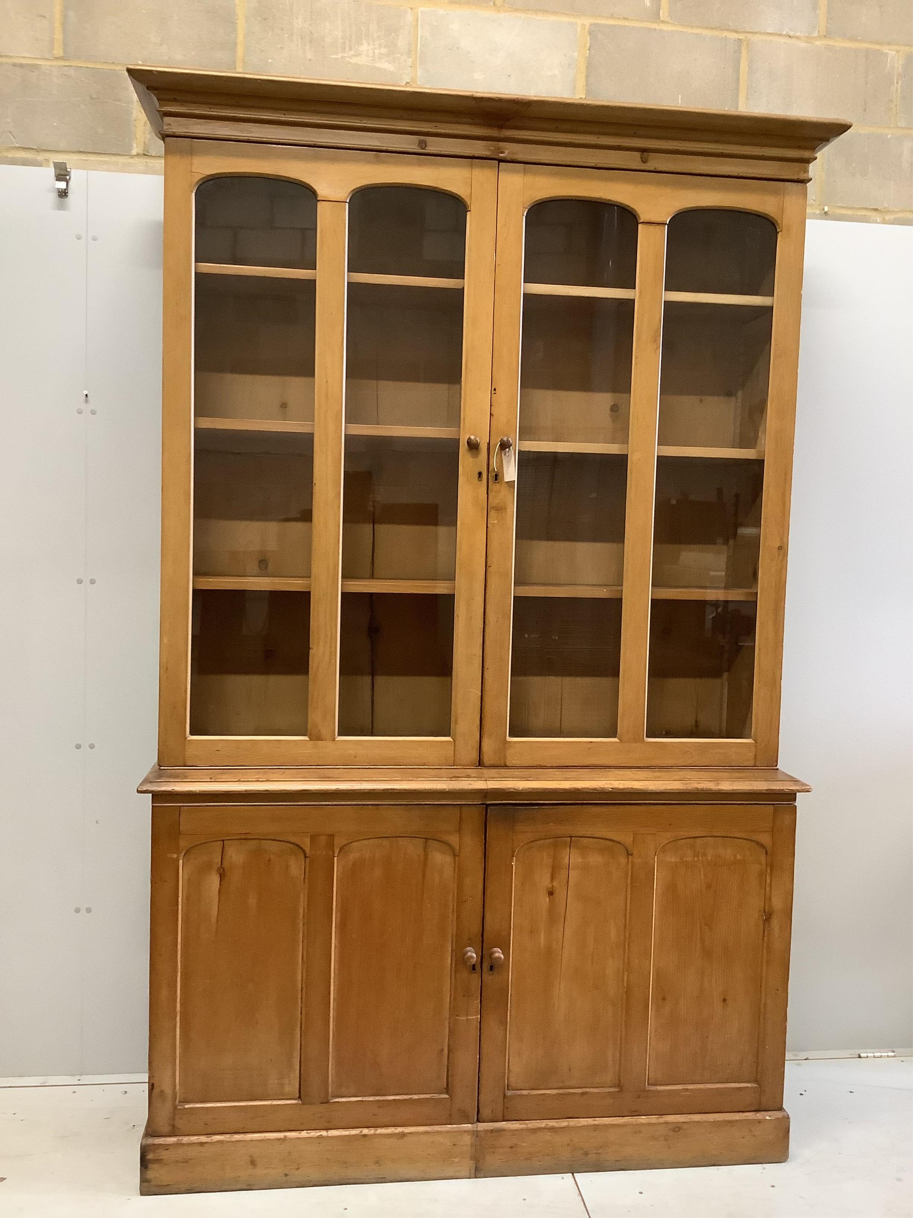 A Victorian pine library bookcase, width 154cm, depth 46cm, height 242cm. Condition - fair